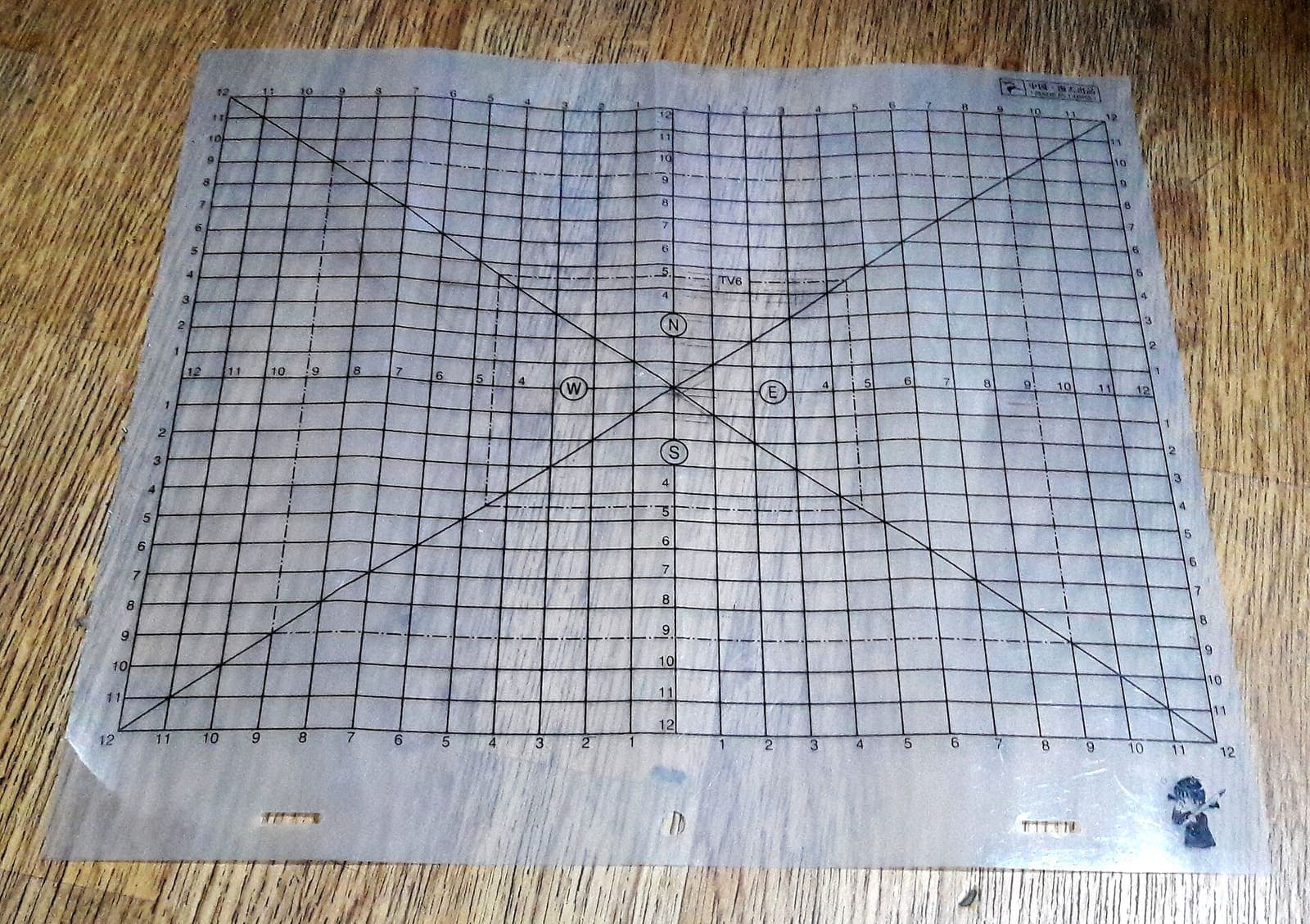 Animator’s translucent layout sheet with field guides and peg holes